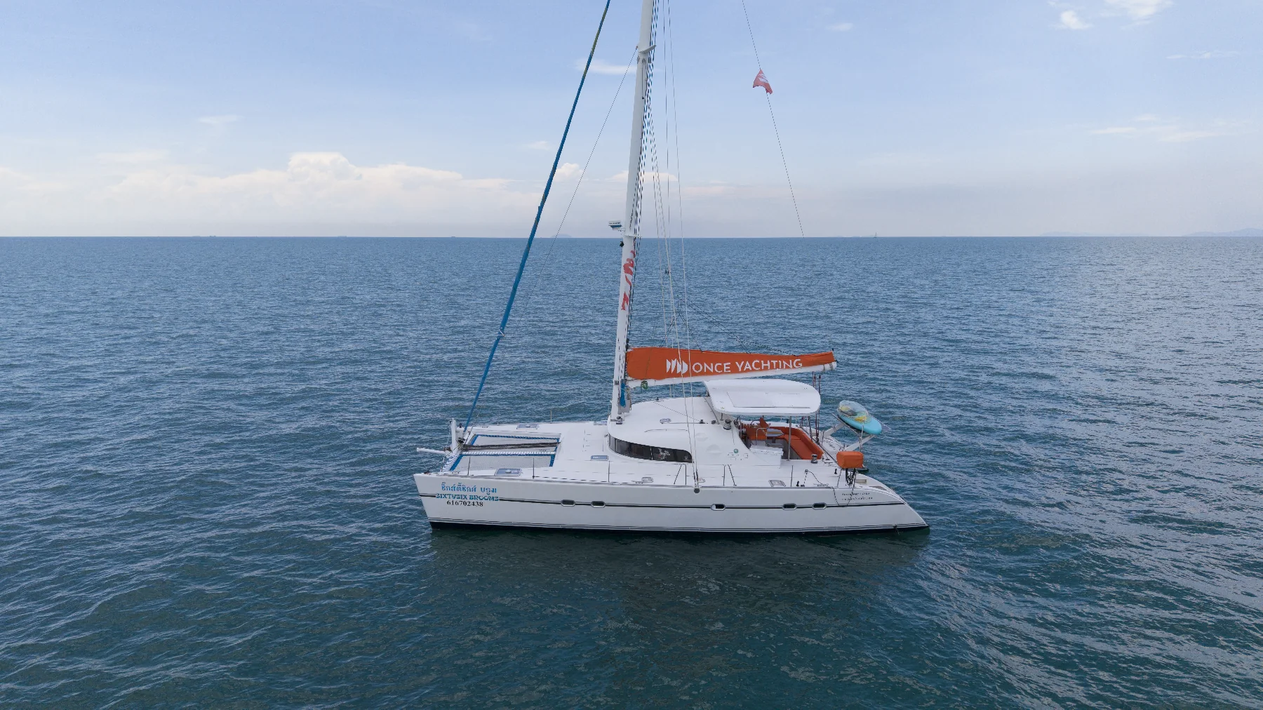 Prosecco sailing catamaran in coastal waters