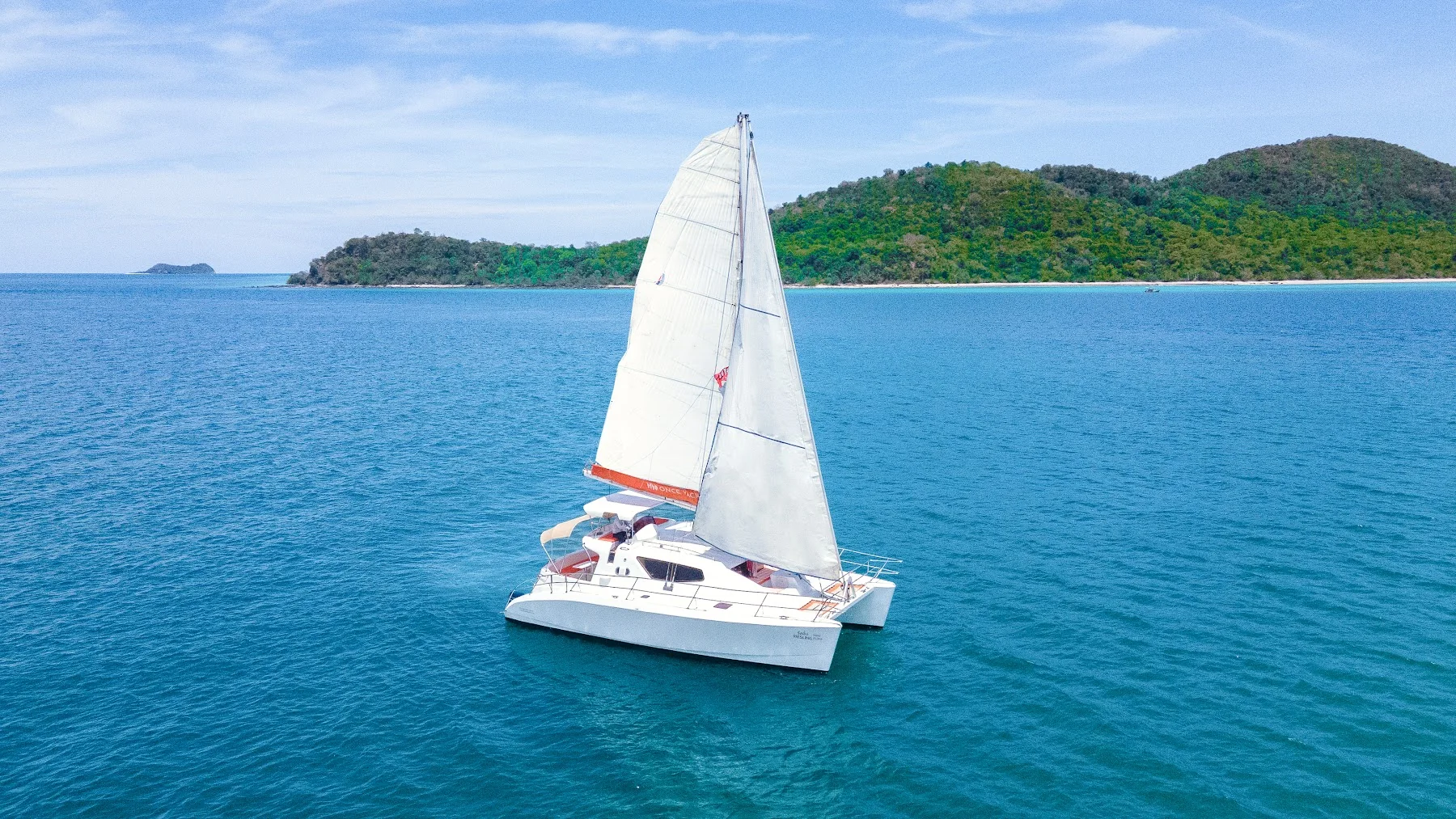 Riesling sailing catamaran in coastal waters