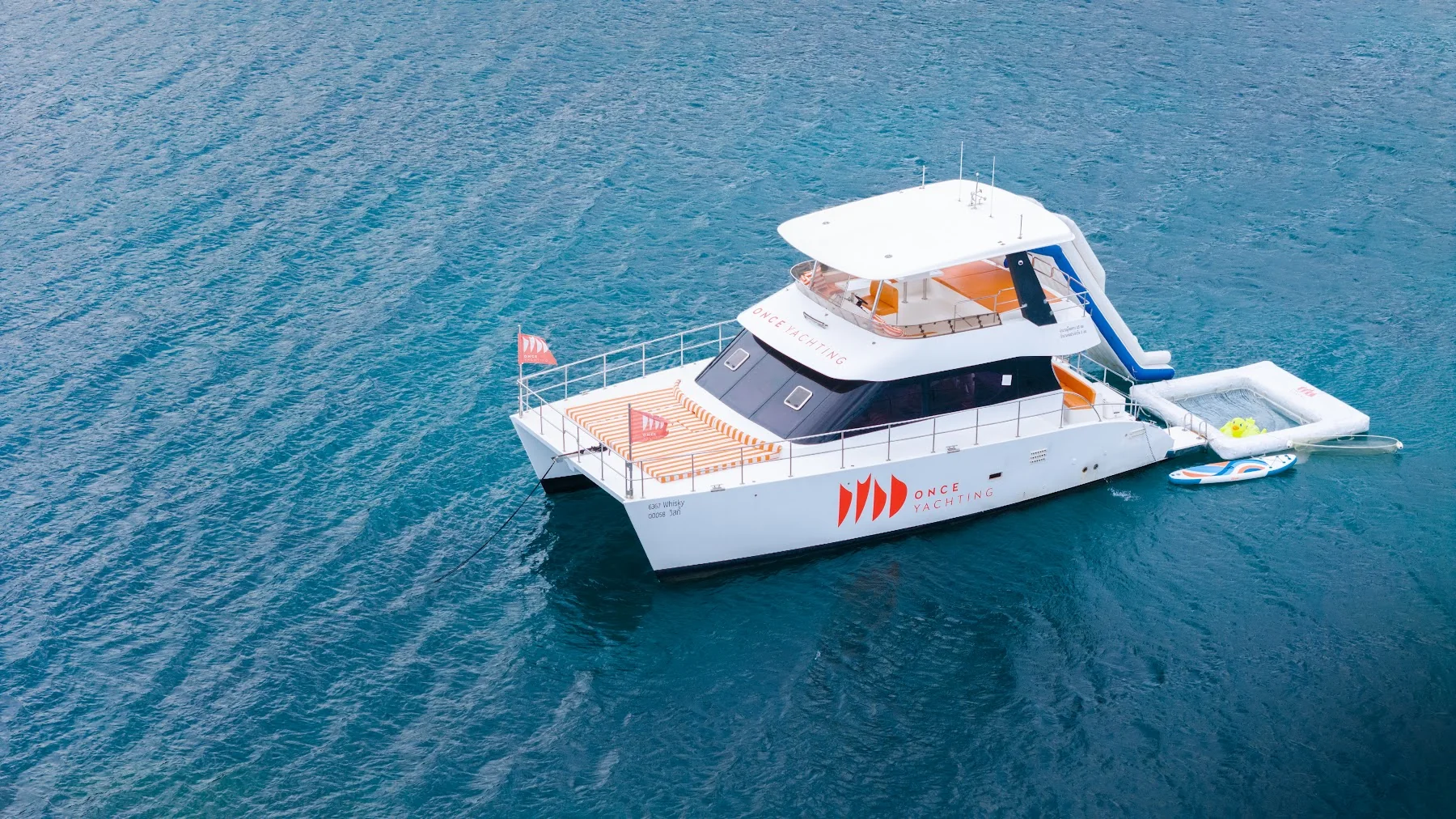 Whisky power catamaran in coastal waters