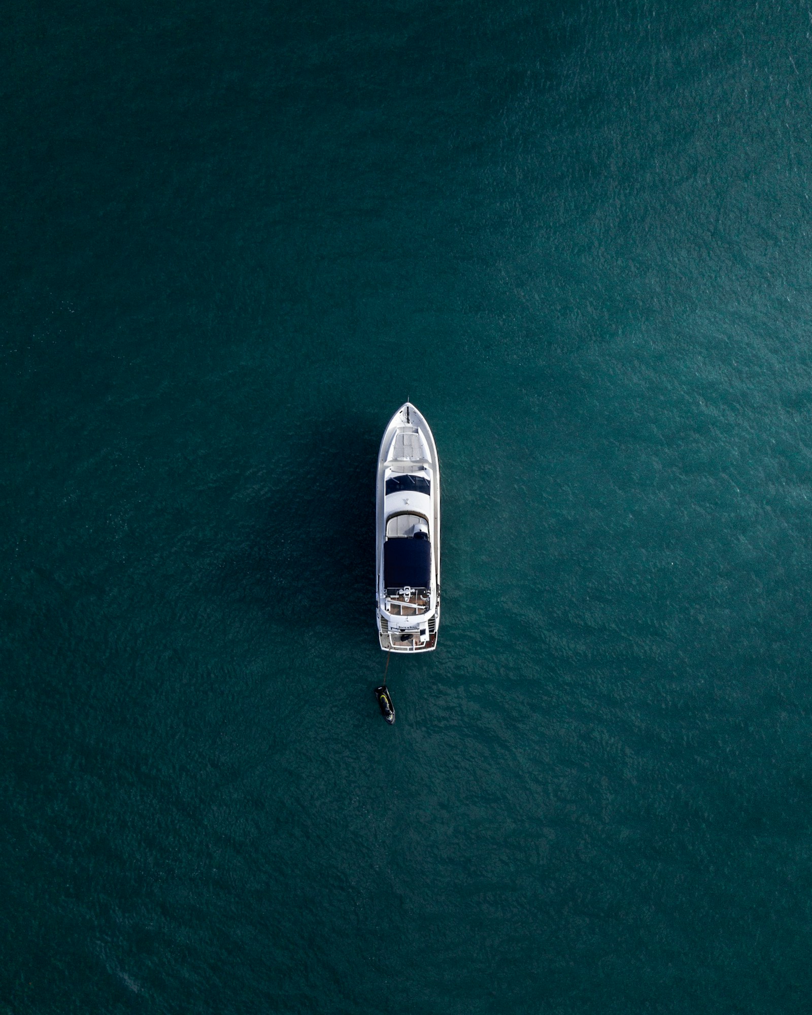 Editorial aerial photograph of a boat at sea; actual tour vessel is confirmed before travel